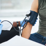 Doctor checking a patient's blood pressure